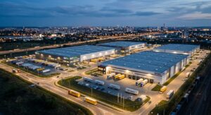 A professional, high-angle editorial photograph of a modern industrial logistics park at twilight in