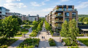 A professional editorial shot of a modern, vibrant Silesian residential district featuring contempor