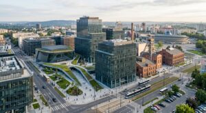 A professional, high-angle cinematic shot of a modern, diverse industrial and tech business district
